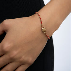 Unlock K Gold String Bracelet